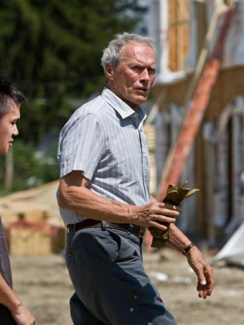 Bee Vang, left, and Clint Eastwood are shown in a scene from, 'Gran Torino'. Photo/Warner Bros.,...
