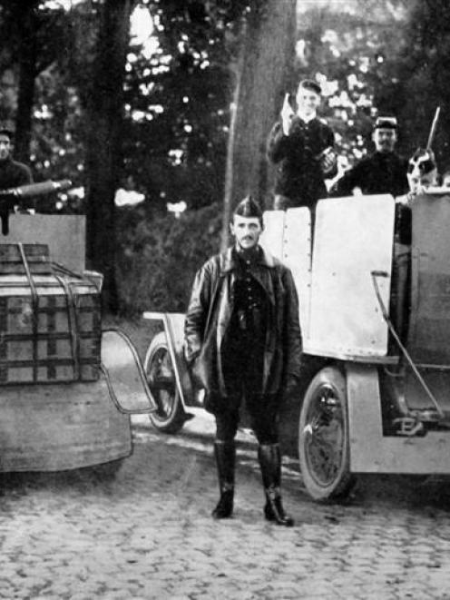 Belgian armoured cars at the front near Tirlemont. The one at left has a quick-firing gun and the...