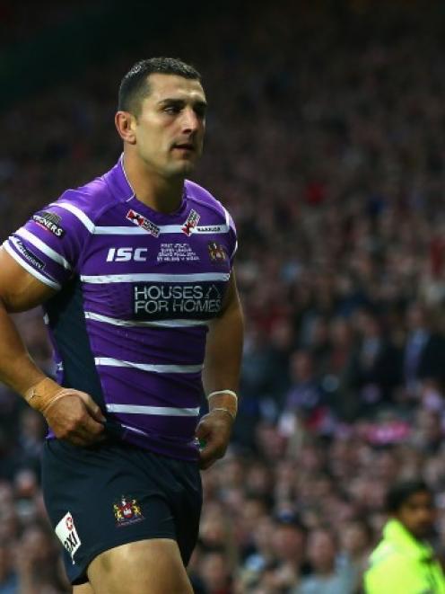 Ben Flower leaves the field after receiving a red card for hitting Lance Hohaia during the Super...