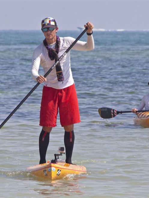 Ben Friberg paddles the last few metres to arrive in Key West, Florida.   REUTERS/Carol Tedesco...