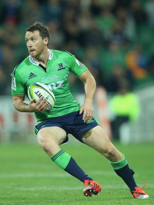 Ben Smith of the Highlanders runs with the ball during the Super Rugby round 15 match between the...