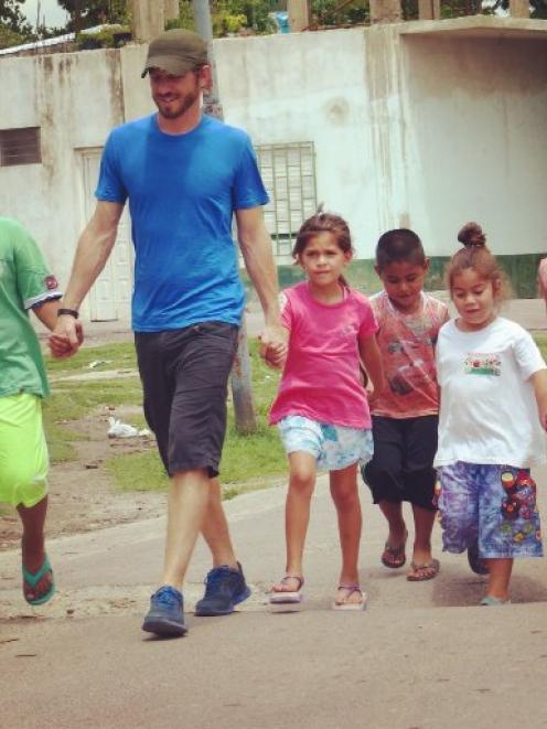 Ben Whitaker takes a group of children  to breakfast at the Food For Thought kitchen in Buenos...