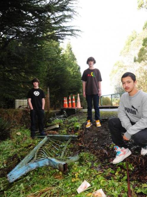 Benjy Mathieson (17) surveys the scene of an accident with (from left) Nathan Peters (13) and...