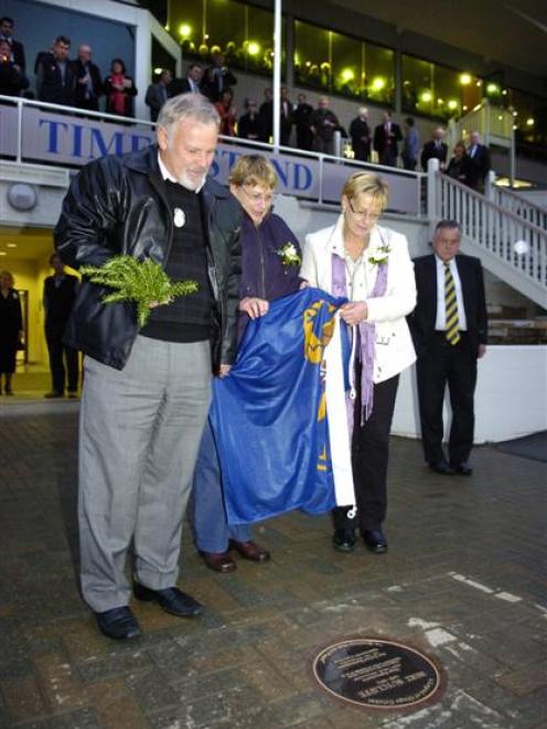 Bert Sutcliffe's son Gary and daughters Christine Philippe and Lynn Scott unveil a commemorative...