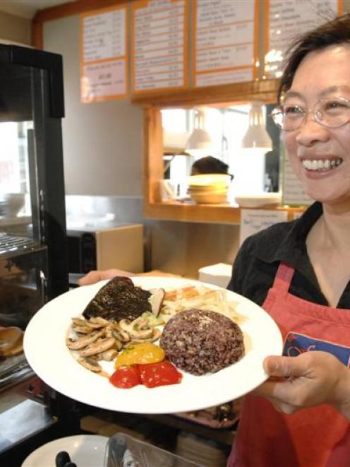 Bi-Hua Huang Lin has graduated with a master of education degree and opened a cafe in Albany St,...