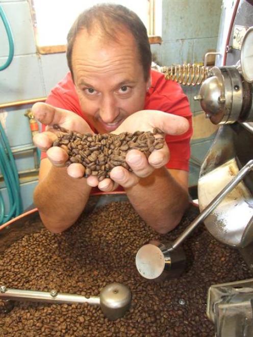 Bill Yuill, of Bean Around the World,  with some of his award-winning coffee beans.  For the...