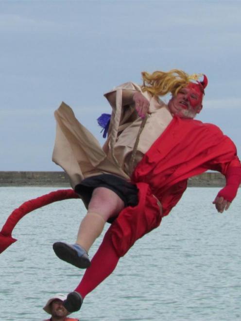 Birdman competition winner Campbell Russell, of Oamaru, jumps into first place yesterday. Photo...