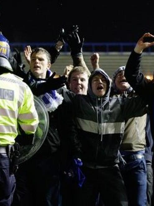 Birmingham City fans confront Aston Villa fans and the police after winning their English League...