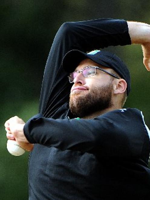 Black Caps all-rounder Daniel Vettori rolls his arm over during team training at the University...