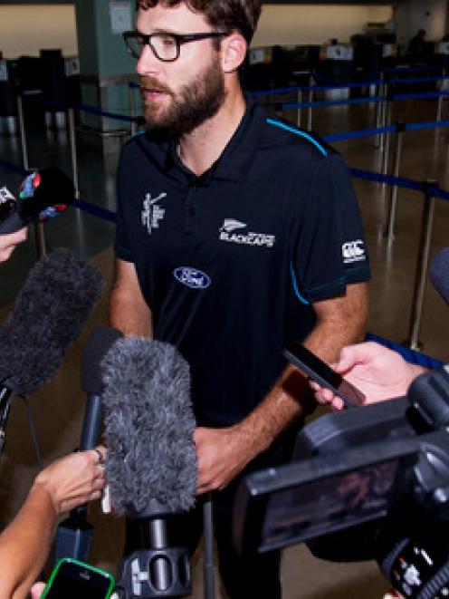 Daniel Vettori talks to the media at Auckland International Airport. Photo / Dean Purcell