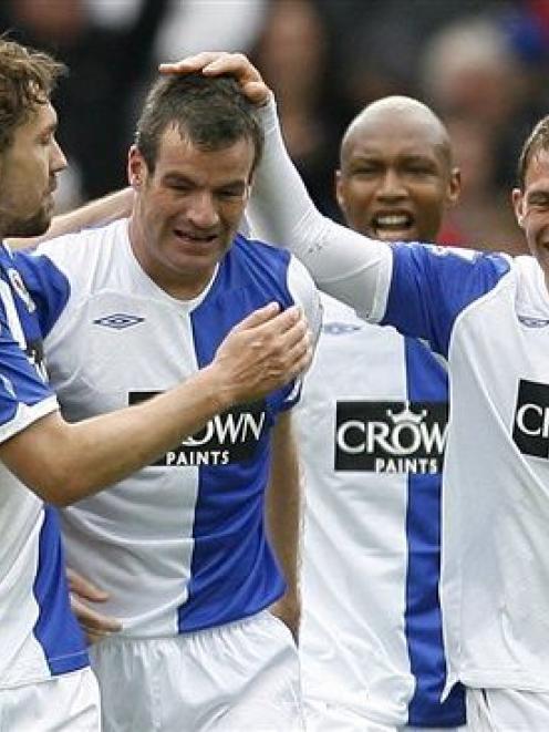Blackburn's Ryan Nelsen, 2nd left, reacts after scoring a goal with teammates El Hadji Diouf, at...