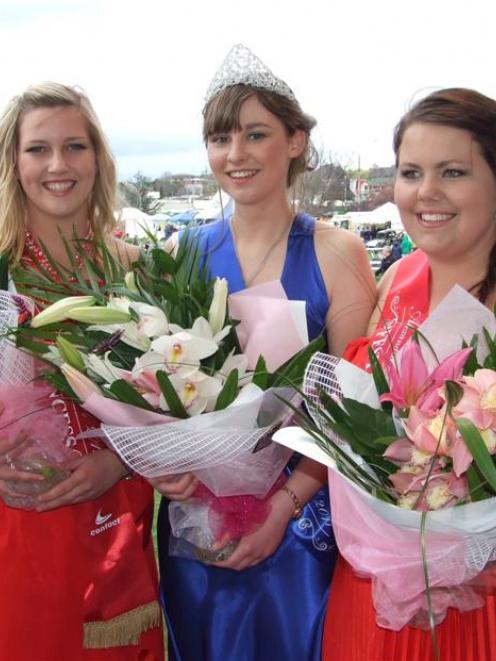 Blossom Festival queen winner Vikki Sanson (centre), flanked by second-placegetter Shaun Robinson...