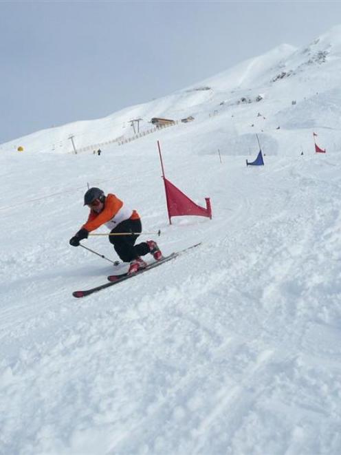 Bob Meyer, of Colorado, takes on a telemark ski race slalom course at a first of its kind race...