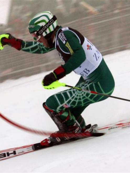 Bode Miller of the United States speeds down the course during the first run of an alpine ski,...