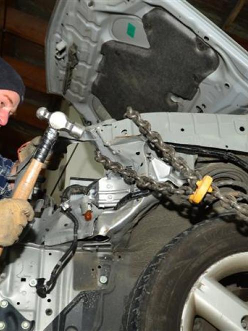Bodyline Collision Centre panelbeater Hamish Munro at work this week. Photo by Peter McIntosh.