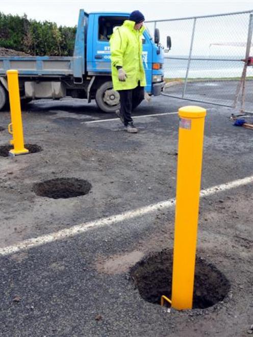 Bollards being installed on John Wilson Ocean Dr last year. Photo by Craig Baxter.