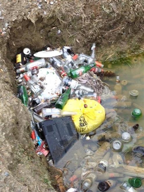 Bottles and general rubbish lie on the side of Flagstaff-Whare Flat Rd, Dunedin, on Saturday....