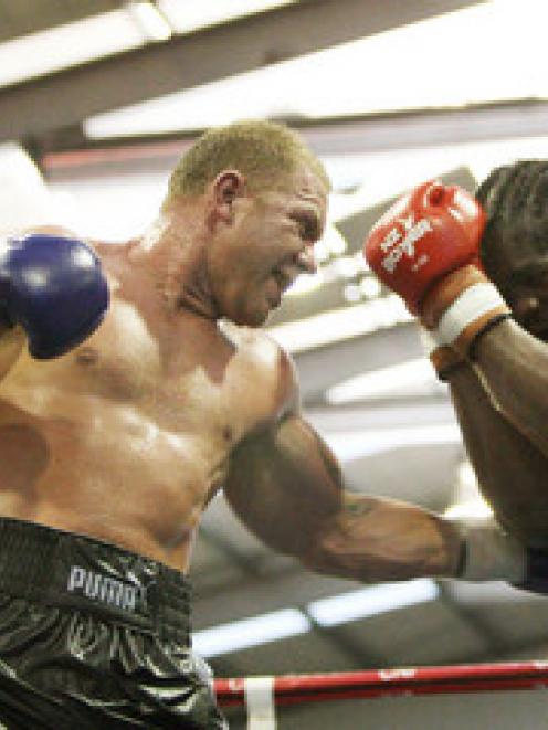 Shane "Mountain Warrior" Cameron lands a blow on Robert Davis during their fight at the Gisborne...