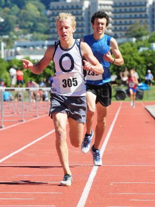 Bryce Morgan wins the 1500m senior boys race, edging out Daniel Boucher at the Otago secondary schools athletics championship. Photo by Craig Baxter.