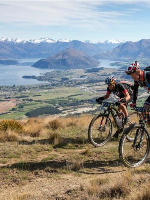 Braden Currie and Dougall Allan ride on the mountain bike stage of the Red Bull Defiance...