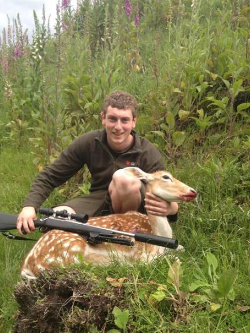 Bradley Robertson (19) with his fallow deer, shot on private property at Waitahuna, South Otago....