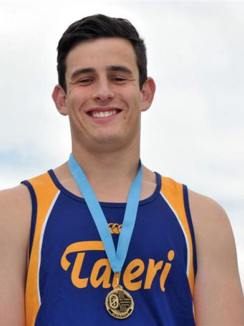 Bradley Tarleton shows off his national secondary schools gold medal. Photo by Gregor Richardson.