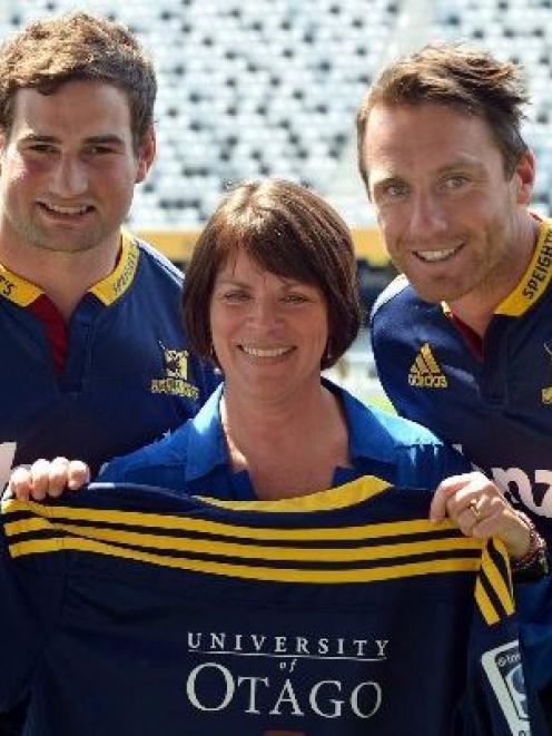 Brand exposure . . . Highlanders (from left) Craig Miller and Ben Smith with University of Otago...