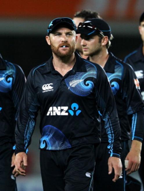 Brendon McCullum leads the Black Caps off the field after the tied ODI match against India at...