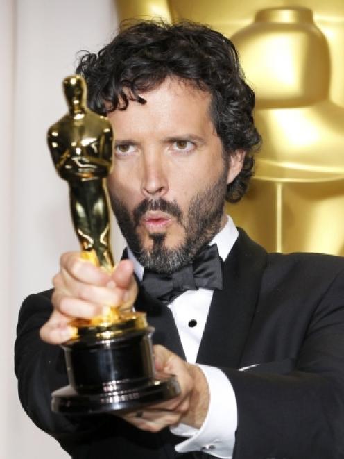 Bret McKenzie holds his Oscar after winning the Music (Original Song) award for the film 'The...