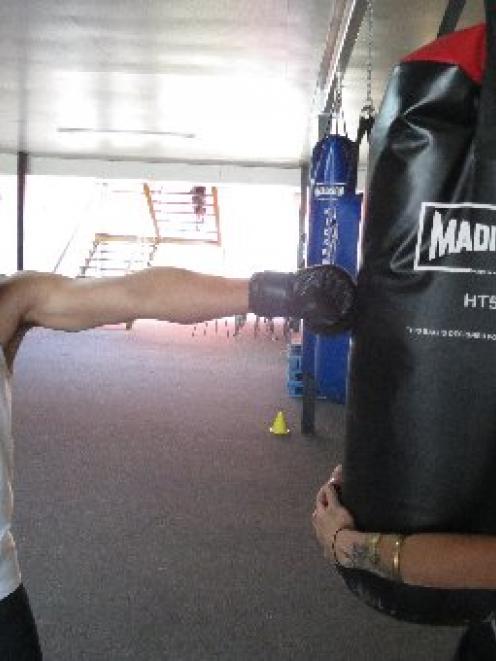 Brett Toia (19) gets a boxing lesson from  Dunedin Training Centre fitness programme co-ordinator...