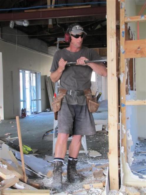 Brian Alexander of Mudgway Construction strips out the interior of the former PGG Wrightson...