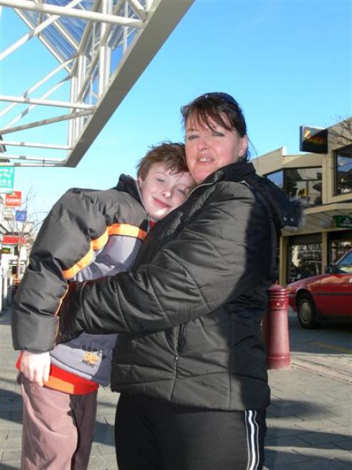 Brian Scott (7) hugs his mother, Sharon, on their last day in Queenstown for the Cure Kids...
