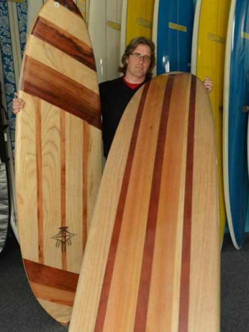 Brighton surfing enthusiast Rob Willers displays some of his wooden surfboards. Photo by Sally Rae.