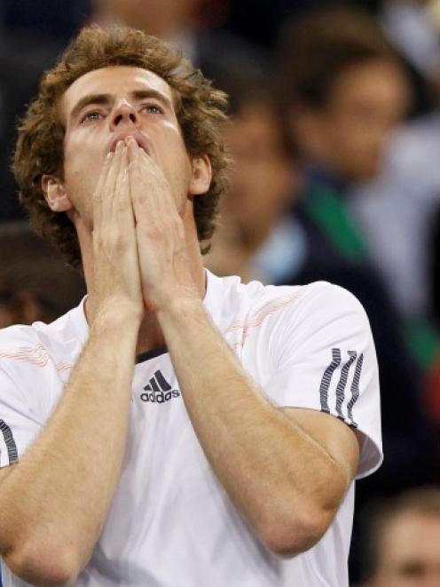Britain's Andy Murray reacts after defeating Serbia's Novak Djokovic to win the US Open tennis...