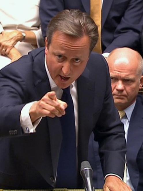 Britain's Prime Minister David Cameron is seen addressing the House of Commons about launching...