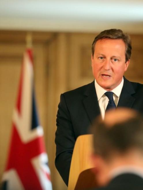 Britain's Prime Minister David Cameron speaks at a news conference in Downing St, central London....