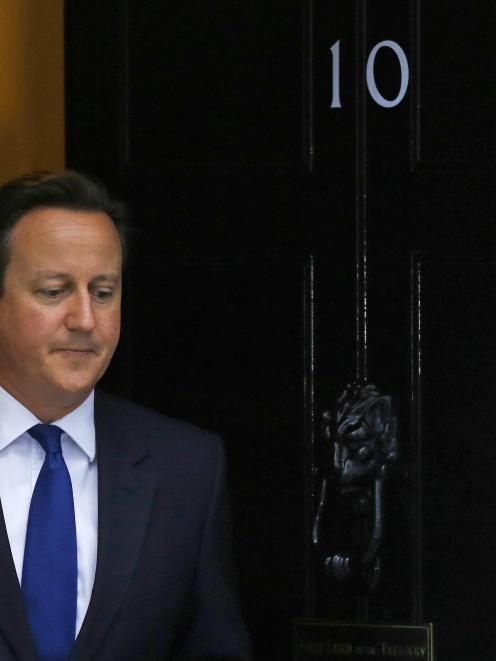 Britain's Prime Minister David Cameron waits to greets Finland's Prime Minister Alexander Stubb...