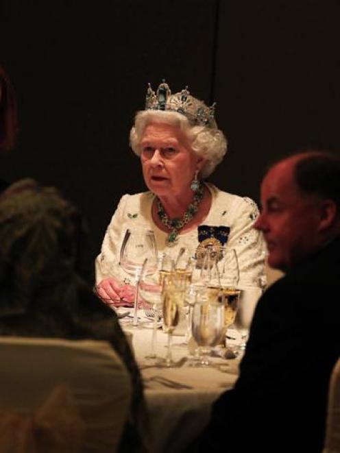 Britain's Queen Elizabeth talks to Australian Prime Minister Julia Gillard during the a banquet...