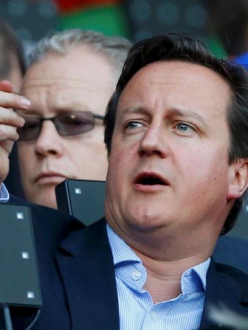 British Prime Minister David Cameron watches Olympics athletics events at the Olympic Stadium in...