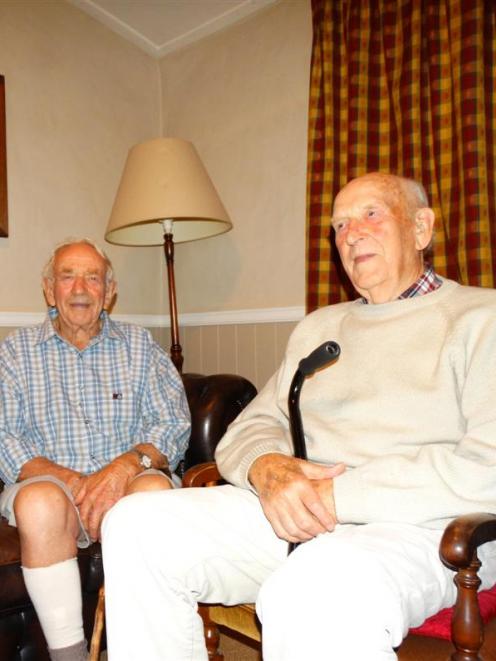 Brothers Gordon (left) and Bob Pittaway  catch up in the lounge of Pittaway's Cottage, their old...