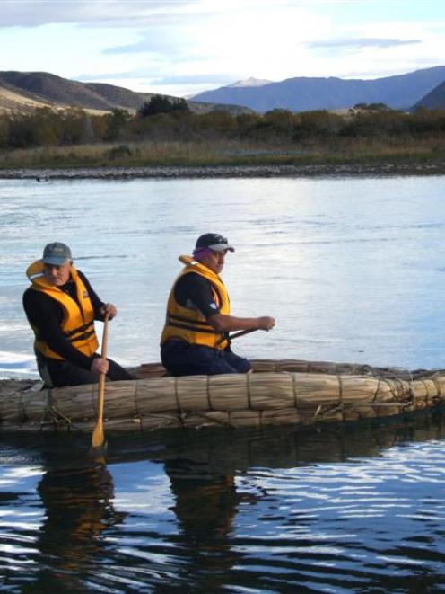 Bruce Parker (rear) and Shane Te Maiharoa leave the Kurow bridges on Saturday morning to paddle...
