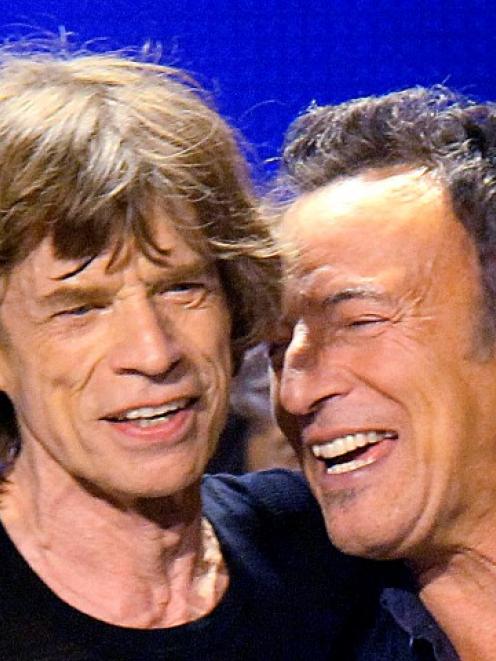 Bruce Springsteen (R) joins Mick Jagger onstage during the Rolling Stones' final concert of their...