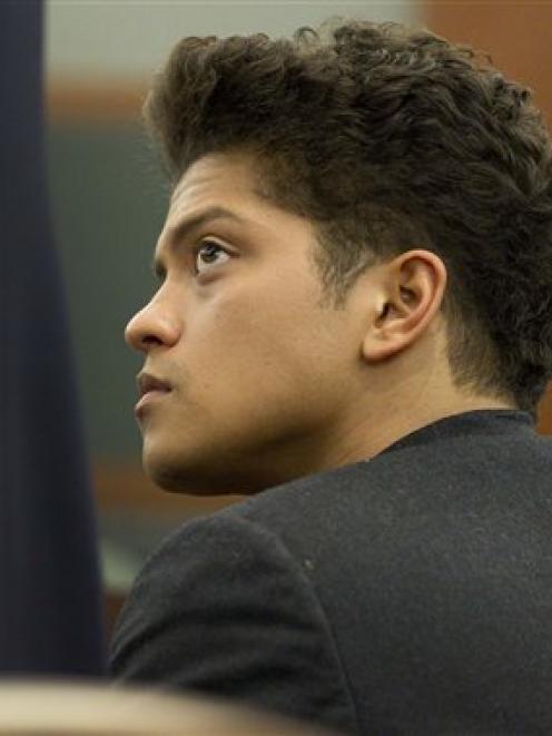 Bruno Mars listens as his defence attorney talks about the terms of his plea deal in district...