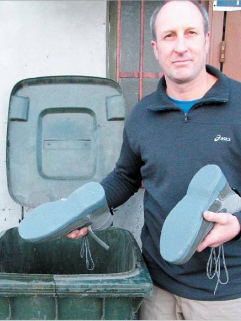 Bryan Burgess, co-owner of B&B Sports Ltd, Gore, with the offending felt-soled footwear. Photo by...