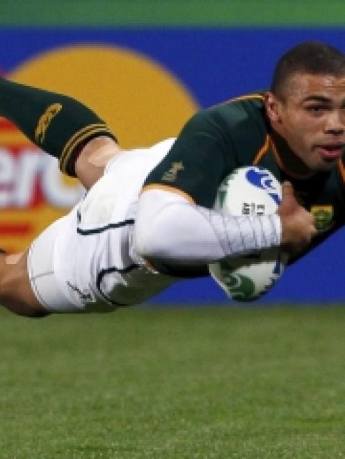 Bryan Habana, of South Africa's Springboks, scores a try during a Rugby World Cup Pool D match...