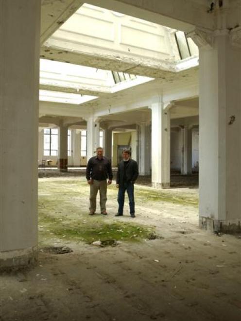 Building owner Geoffrey Thomson (left) and Opus architect Jeff Thompson on the ground floor below...