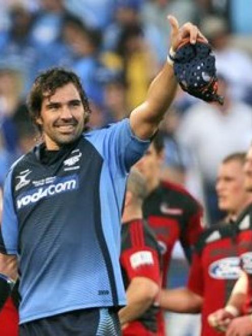 Bulls captain Victor Matfield gestures to fans after his team beat the Crusaders in a Super 14...