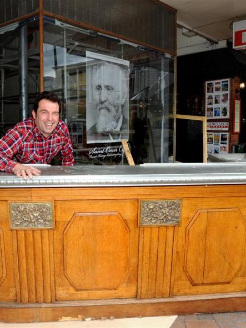 Cafe St Omer owner Olivier Lequeux with his old French counter. Photo by Peter McIntosh.