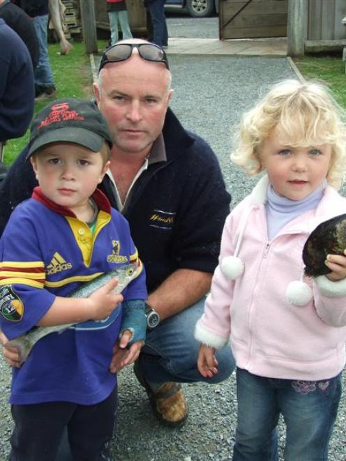 Caleb Jones (2), of Timaru, shows off the yellow-eyed mullet he caught in the Nugget Point Easter...