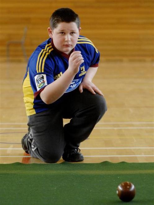 Callum Horwell (Logan Park High School) demonstrates his skills on the indoor bowls mat. Photo by...